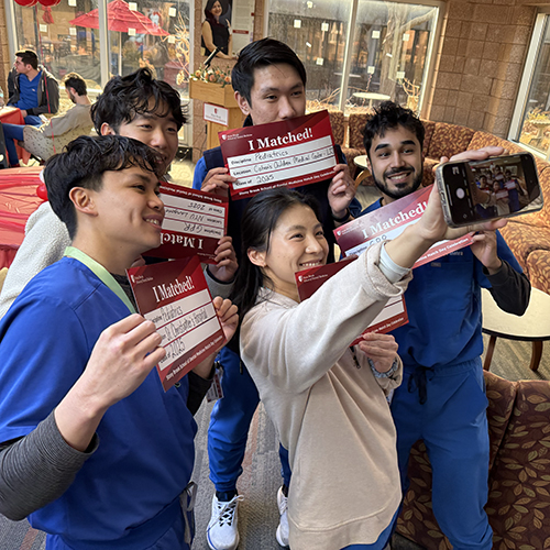 Students taking a selfie showing their residency destinations