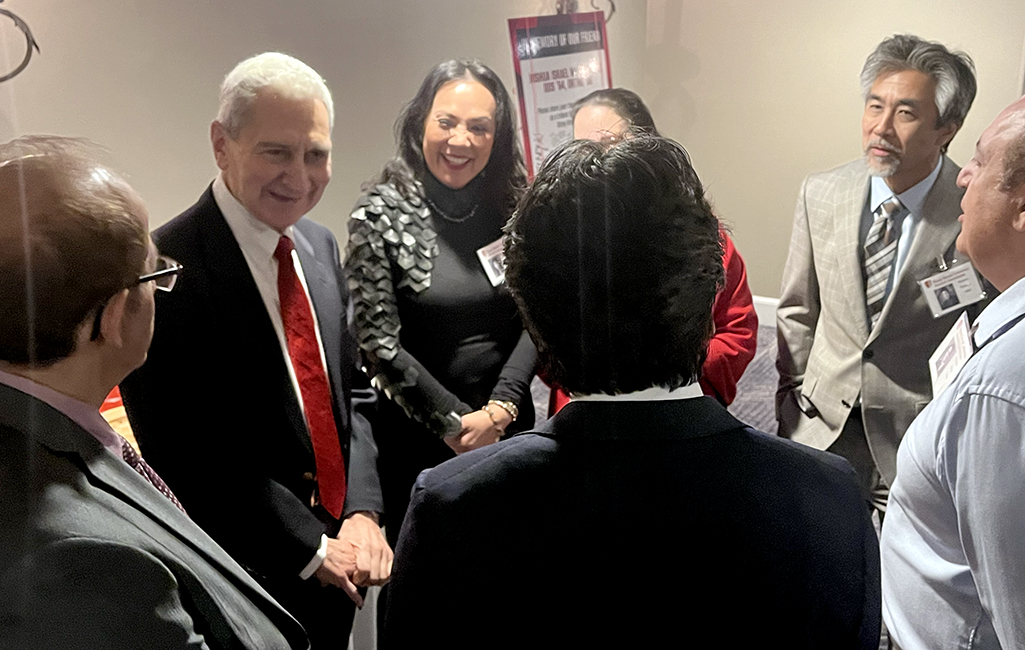 Graduates at the Alumni Class Reunion speak with longtime faculty member Vincent Iacono