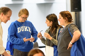 Students examining new equipment at vendor fair